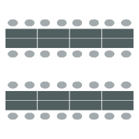 Rows of long tables with chairs on each side of the table but not at the ends. Seats 16 per table.
