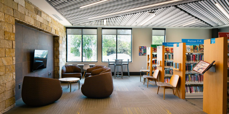 Photo of a room with chairs and bookshelves