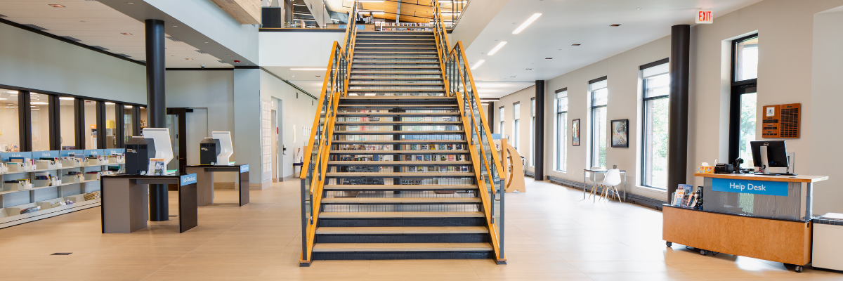 Staircase in a lobby next to a desk