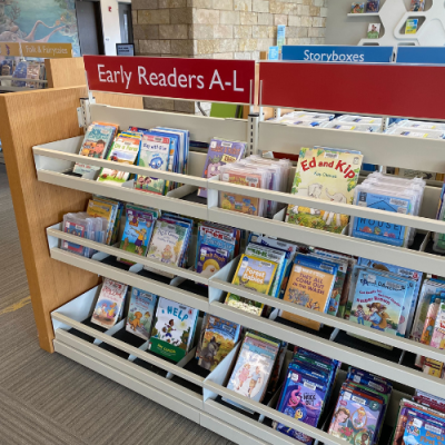 A shelf of books labeled "Early Readers A-L"
