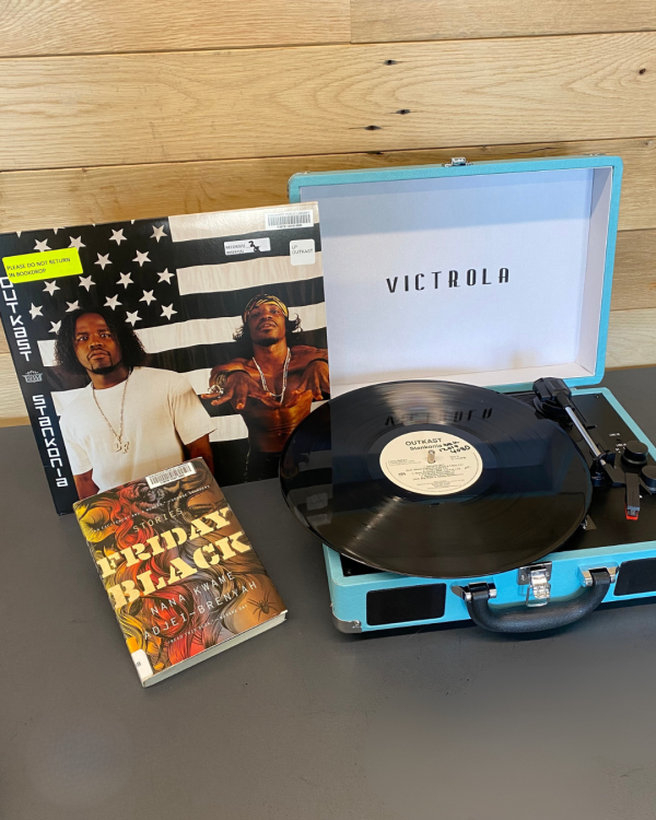 Stankonia by Outkast record next to Friday Black book