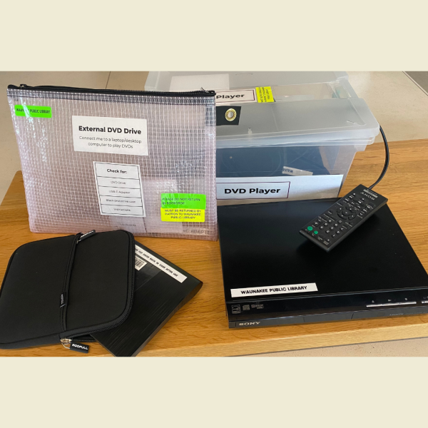 External DVD drive next to a DVD player and remote