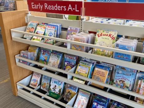 A shelf of books labeled "Early Readers A-L"