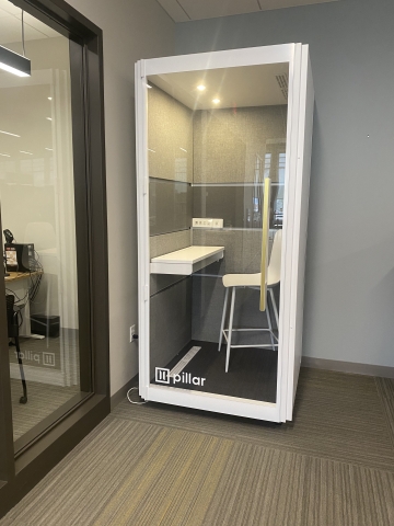 Photo of a booth with a stool in it