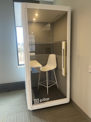 Photo of a booth with a stool in it