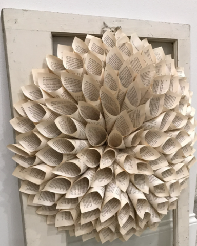 Book wreath hanging from a door frame