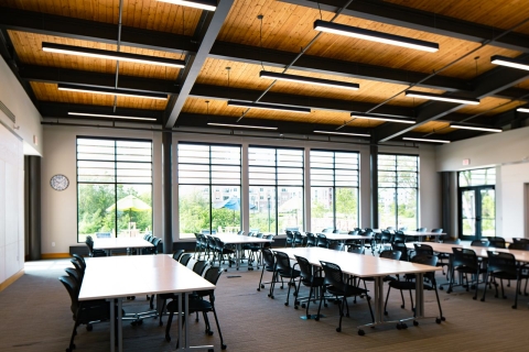 Room with large windows and banquet tables