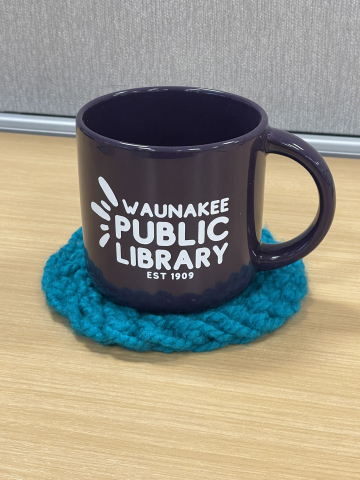 Purple mug on teal crocheted coaster