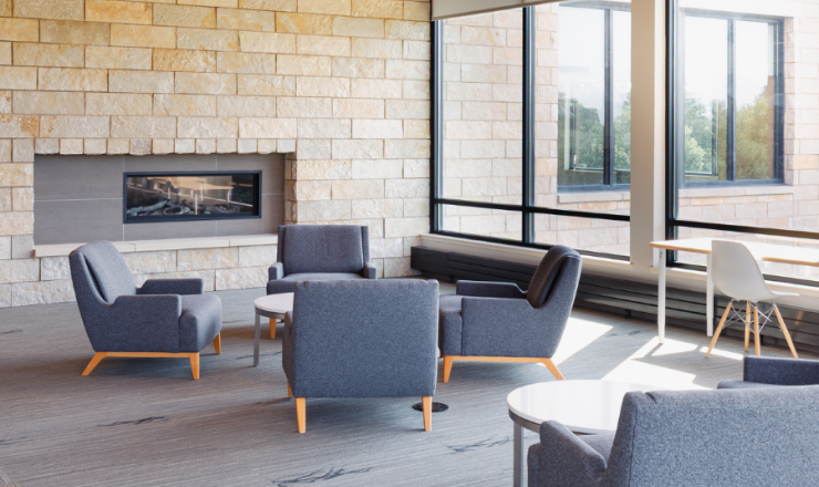 Chairs arranged in a circle next to a fireplace