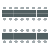 Rows of long tables with chairs on each side of the table but not at the ends. Seats 16 per table.